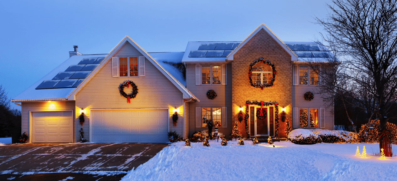 house with solar panels with Christmas decorations